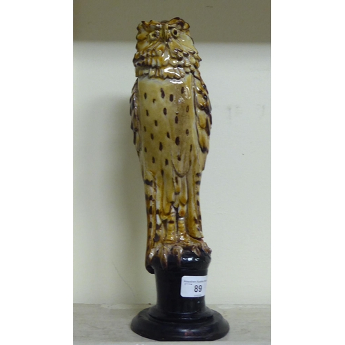 A Chelsea Pottery Painted And Glazed Terracotta Model An Owl Perched