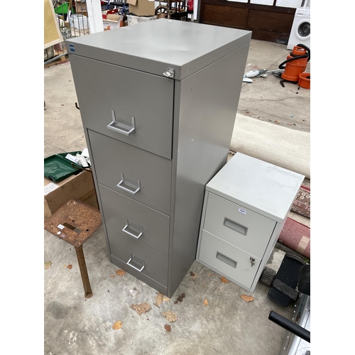 A Four Drawer Metal Filing Cabinet And A Further Two Drawer Metal