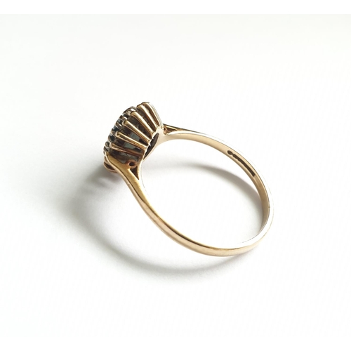 32 - Hallmarked 9ct gold ring with centre sapphire and a diamond surround, oval shape , approx 3g size T.