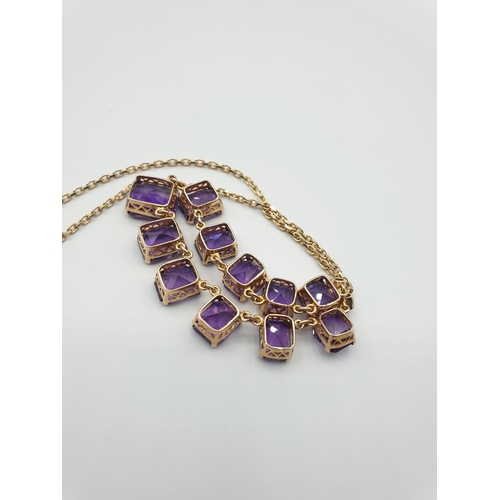 56 - 9CT YELLOW GOLD AMETHYST NECKLACE, Size of the biggest stone is 11 x 9ml .WEIGHT 15.8G AND 40CM LENG... 