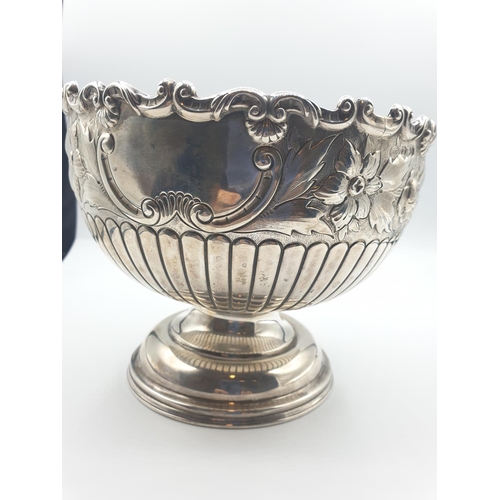 1 - A silver fruit bowl 1901 by J.Round of Sheffield with floral repousse work under a scrolled edge in ... 