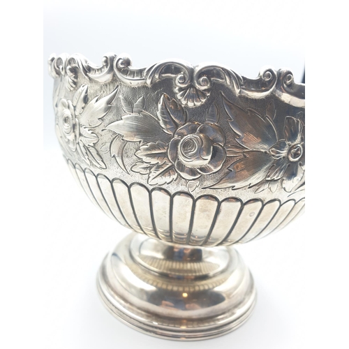 1 - A silver fruit bowl 1901 by J.Round of Sheffield with floral repousse work under a scrolled edge in ... 