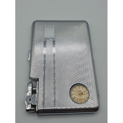 19 - A chromium cigarette case by 'Aircraft' with integral lighter and watch, size 13cm x 8.5cm
