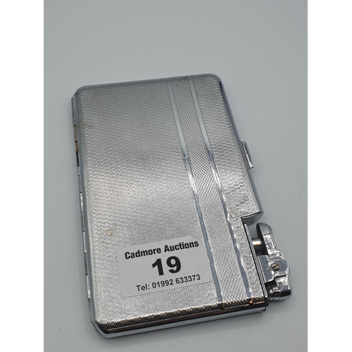 19 - A chromium cigarette case by 'Aircraft' with integral lighter and watch, size 13cm x 8.5cm