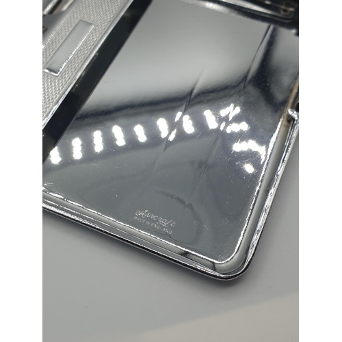 19 - A chromium cigarette case by 'Aircraft' with integral lighter and watch, size 13cm x 8.5cm