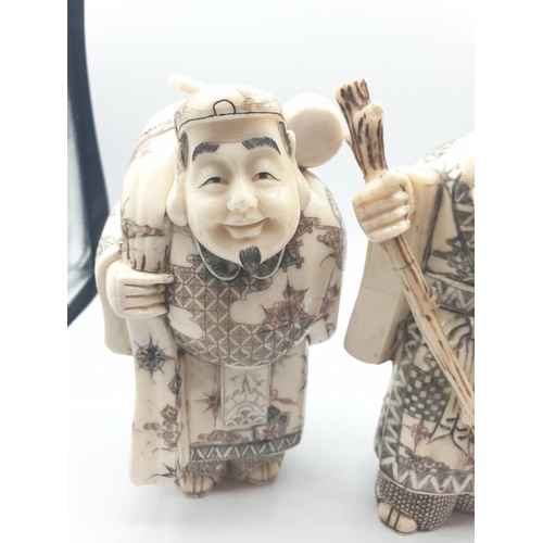 42 - 1910 Antique pair of large Japanese Okimono bone and 
 ivory figures, 20cm tall