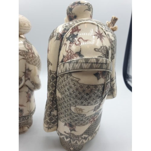 42 - 1910 Antique pair of large Japanese Okimono bone and 
 ivory figures, 20cm tall