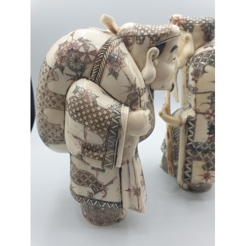 42 - 1910 Antique pair of large Japanese Okimono bone and 
 ivory figures, 20cm tall