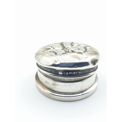 261 - Unusual small silver round pill box with faces on the lid
