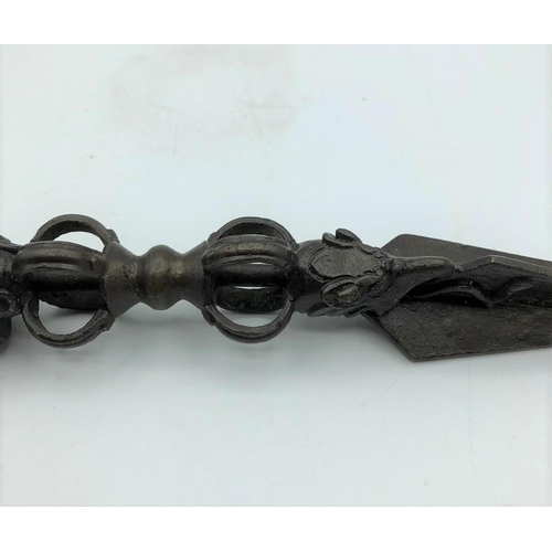 252 - Antique Oriental ceremonial dagger. 3 faces on hilt 10.9oz. 23cms in length