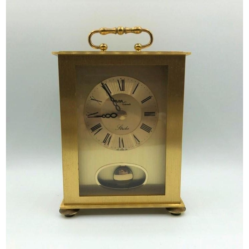 256 - Avia carriage clock in yellow metal. With pendulum, roman numerals, battery operated. W 12.3cm x L 1... 