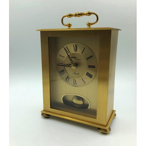 256 - Avia carriage clock in yellow metal. With pendulum, roman numerals, battery operated. W 12.3cm x L 1... 