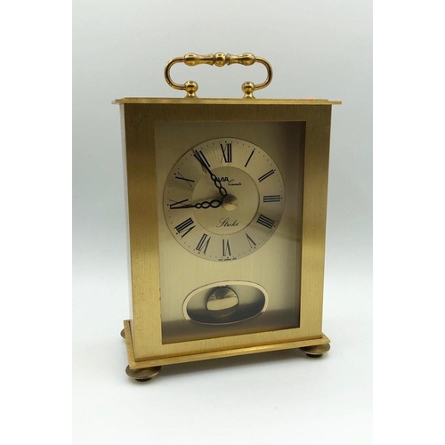 256 - Avia carriage clock in yellow metal. With pendulum, roman numerals, battery operated. W 12.3cm x L 1... 