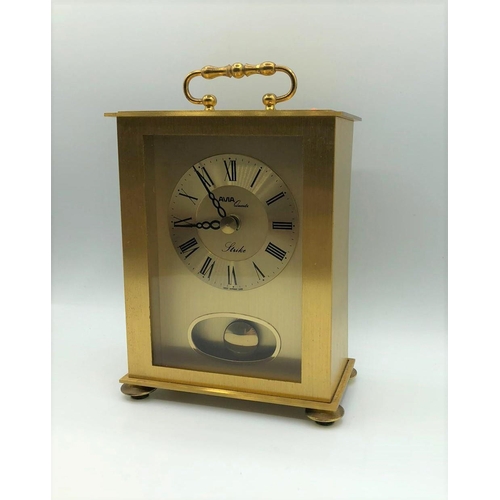 256 - Avia carriage clock in yellow metal. With pendulum, roman numerals, battery operated. W 12.3cm x L 1... 