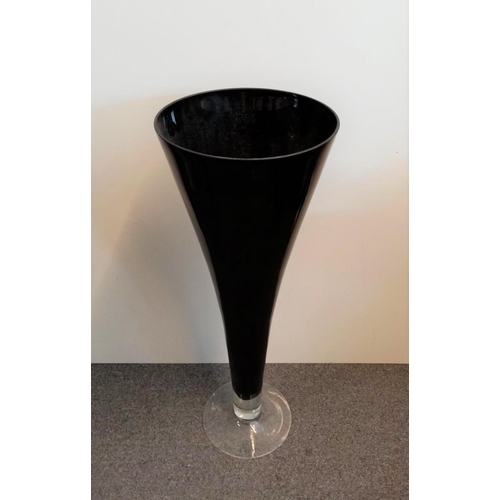 273 - Large black glass floor vase, Tapered cone shape with clear base.L59.3cm