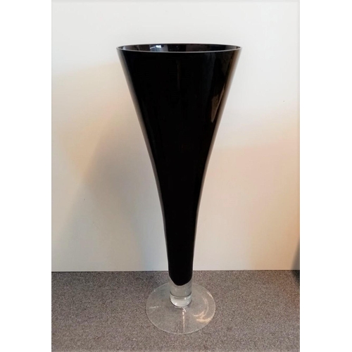 273 - Large black glass floor vase, Tapered cone shape with clear base.L59.3cm