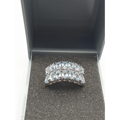 281 - Stone set silver ring with 2 rows of 7 pale blue (14 stones) Semi precious stones. Clear 925 stamp a... 