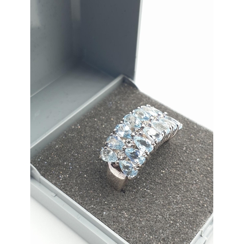 281 - Stone set silver ring with 2 rows of 7 pale blue (14 stones) Semi precious stones. Clear 925 stamp a... 