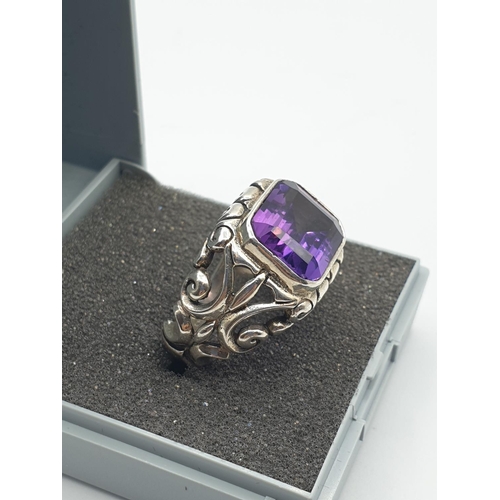 293 - Vintage silver ring with large rectangular purple/blue stone. Alexandrite type colour. Ornate silver... 