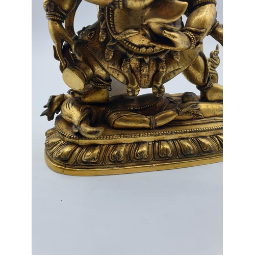 27 - A very early gilded bronze figure of an Oriental dragon god, 19cm tall and weight 1700g.
Gilding is ... 