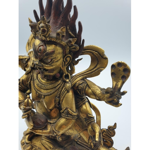 27 - A very early gilded bronze figure of an Oriental dragon god, 19cm tall and weight 1700g.
Gilding is ... 