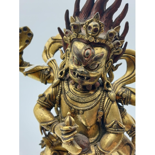 27 - A very early gilded bronze figure of an Oriental dragon god, 19cm tall and weight 1700g.
Gilding is ... 