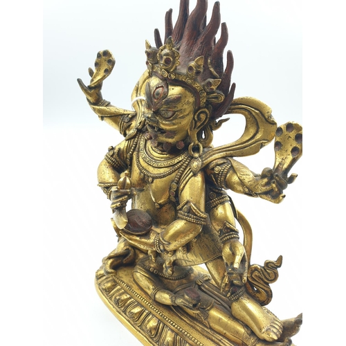 27 - A very early gilded bronze figure of an Oriental dragon god, 19cm tall and weight 1700g.
Gilding is ... 