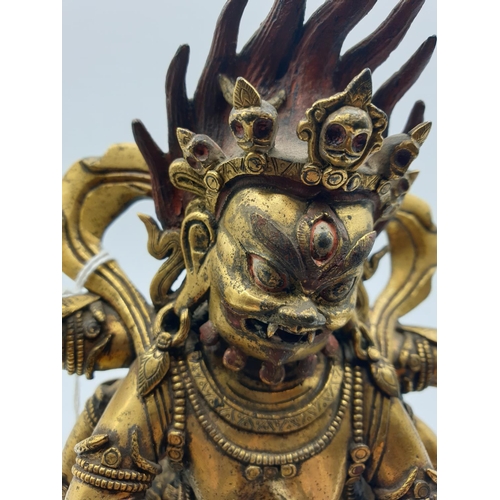 27 - A very early gilded bronze figure of an Oriental dragon god, 19cm tall and weight 1700g.
Gilding is ... 