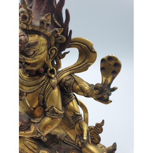 27 - A very early gilded bronze figure of an Oriental dragon god, 19cm tall and weight 1700g.
Gilding is ... 