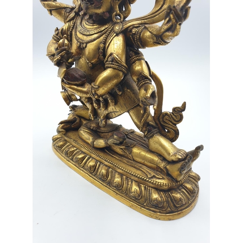 27 - A very early gilded bronze figure of an Oriental dragon god, 19cm tall and weight 1700g.
Gilding is ... 