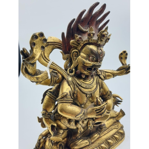 27 - A very early gilded bronze figure of an Oriental dragon god, 19cm tall and weight 1700g.
Gilding is ... 