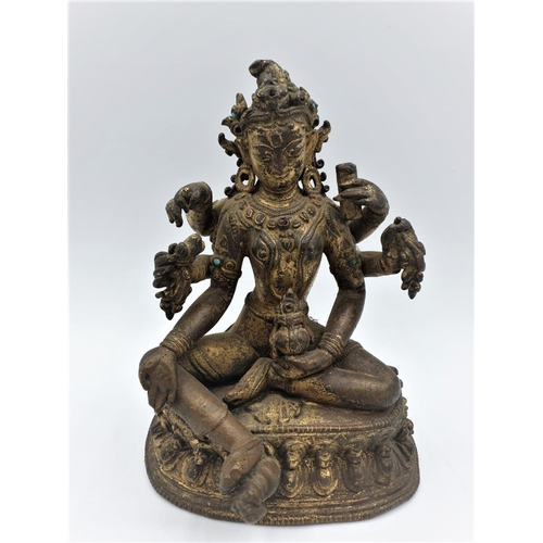 A very early gilded bronze figure of an Oriental 6 arm Goddess, 14cm tall and weighing 1139g.