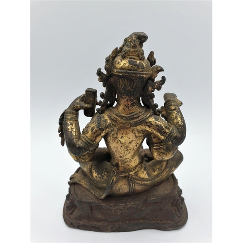 29 - A very early gilded bronze figure of an Oriental 6 arm Goddess, 14cm tall and weighing 1139g.
