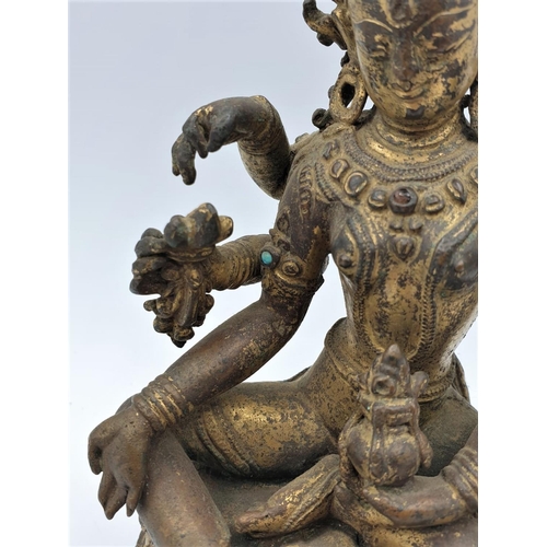 29 - A very early gilded bronze figure of an Oriental 6 arm Goddess, 14cm tall and weighing 1139g.
