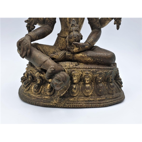 29 - A very early gilded bronze figure of an Oriental 6 arm Goddess, 14cm tall and weighing 1139g.