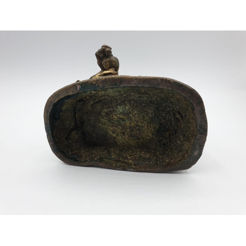 29 - A very early gilded bronze figure of an Oriental 6 arm Goddess, 14cm tall and weighing 1139g.