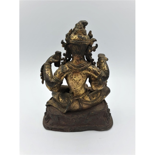 29 - A very early gilded bronze figure of an Oriental 6 arm Goddess, 14cm tall and weighing 1139g.