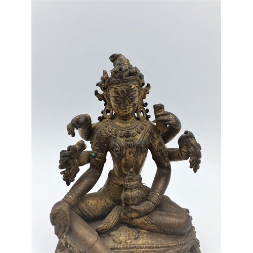 29 - A very early gilded bronze figure of an Oriental 6 arm Goddess, 14cm tall and weighing 1139g.