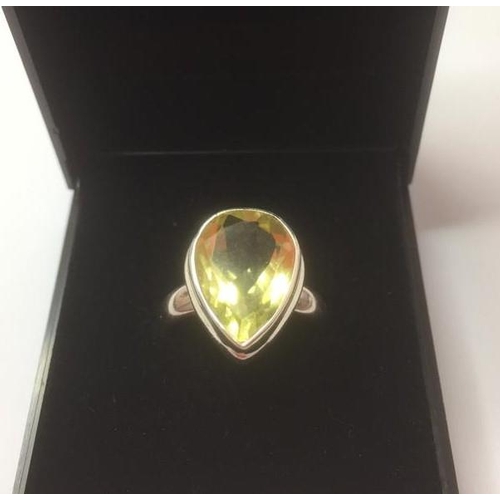 341 - Stone set silver and citrine ring size M, marking inside band for 925 and the genuine gemstone compa... 