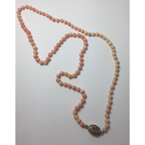 343 - Pale coral bead necklace with silver clasp, knotted beads 50cm long