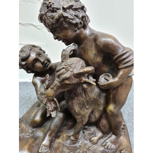 78 - A late 19th century French Bronze Statue of two boys feeding a goat, 35x30x21cm and weight 10.2kg