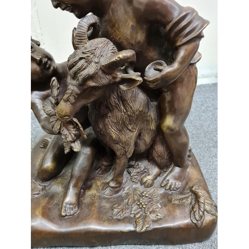 78 - A late 19th century French Bronze Statue of two boys feeding a goat, 35x30x21cm and weight 10.2kg