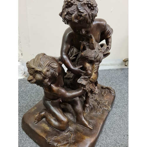 78 - A late 19th century French Bronze Statue of two boys feeding a goat, 35x30x21cm and weight 10.2kg