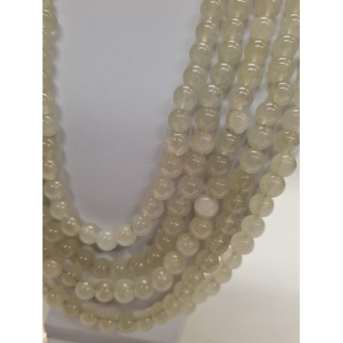 84 - A Chinese five row Pale Jade round beaded Necklace, weight 194g