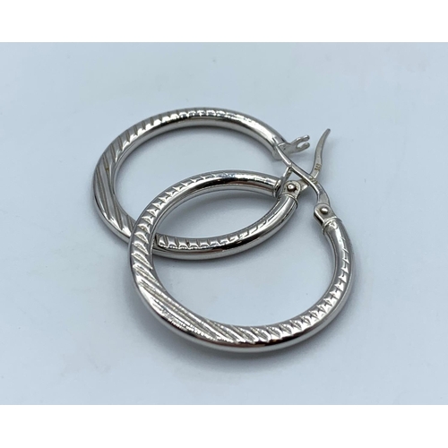 104 - Pair of 9CT White Gold Hoop Earrings, 25mm diameter and weight 2g approx