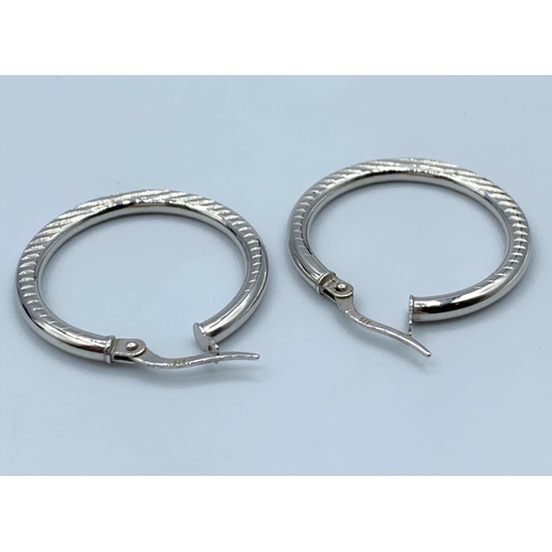 104 - Pair of 9CT White Gold Hoop Earrings, 25mm diameter and weight 2g approx