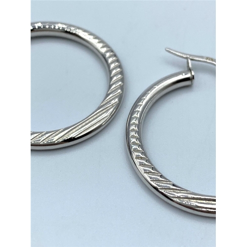 104 - Pair of 9CT White Gold Hoop Earrings, 25mm diameter and weight 2g approx