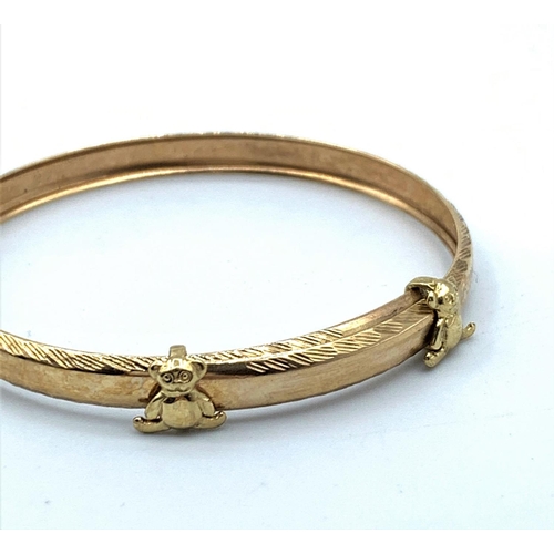 47 - 9CT Yellow Gold Baby Bangle with Teddy Bears decoration, 45mm diameter and weight 2.5g approx