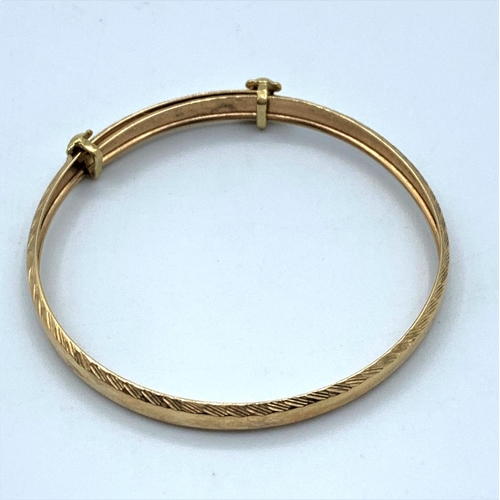 47 - 9CT Yellow Gold Baby Bangle with Teddy Bears decoration, 45mm diameter and weight 2.5g approx