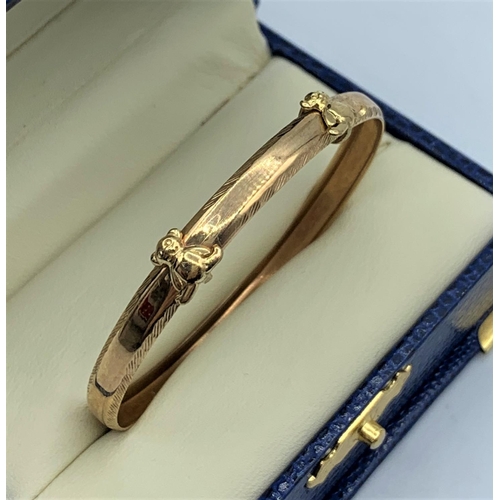 47 - 9CT Yellow Gold Baby Bangle with Teddy Bears decoration, 45mm diameter and weight 2.5g approx